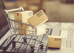 Online shopping parcels in trolley - e-commerce